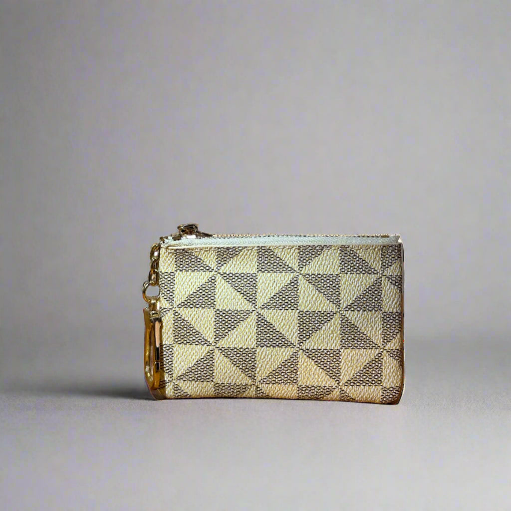 Checkered wallet on a wooden surface with a blurred background