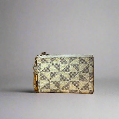 Checkered wallet on a wooden surface with a blurred background